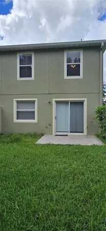 a house view with a backyard space