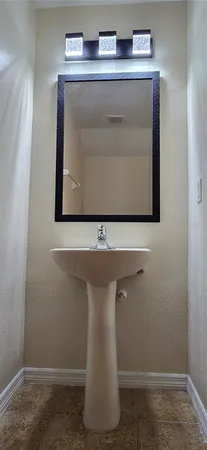 a utility room with a sink washer and dryer