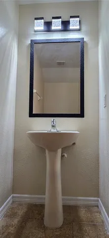 a utility room with a sink washer and dryer