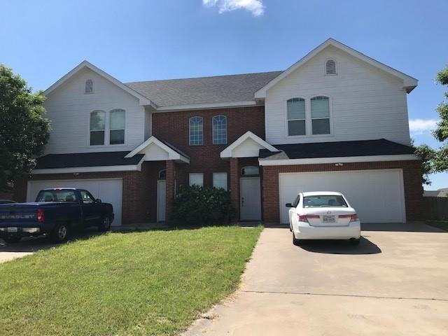 2319 Independence Boulevard, Unit 2317 Abilene, TX 79601 - Photo 1 of 16 a house view with a garden space