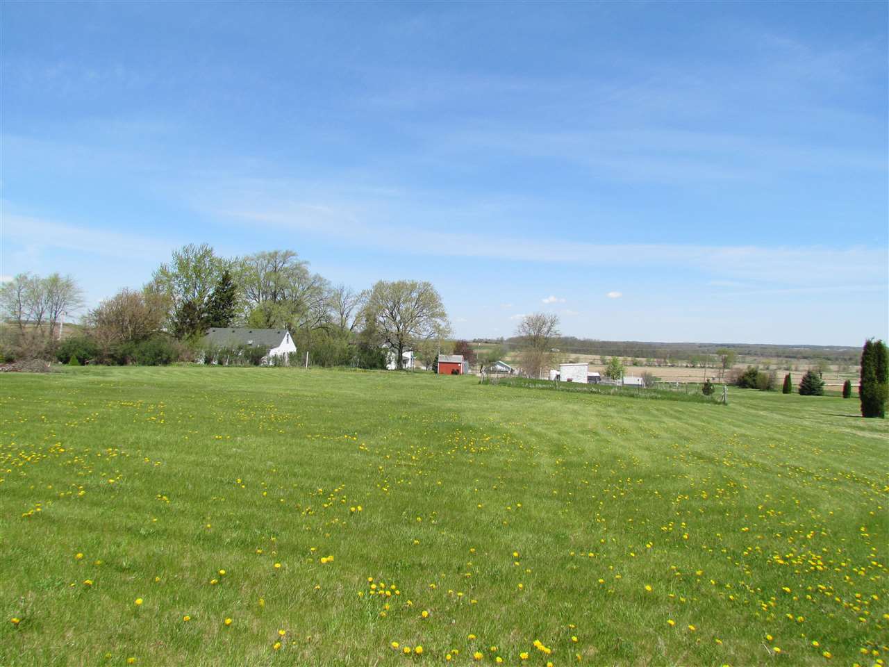10494 Freeport Road Durand, IL 61024 - Photo 25 of 40 a view of a field with an trees in the background