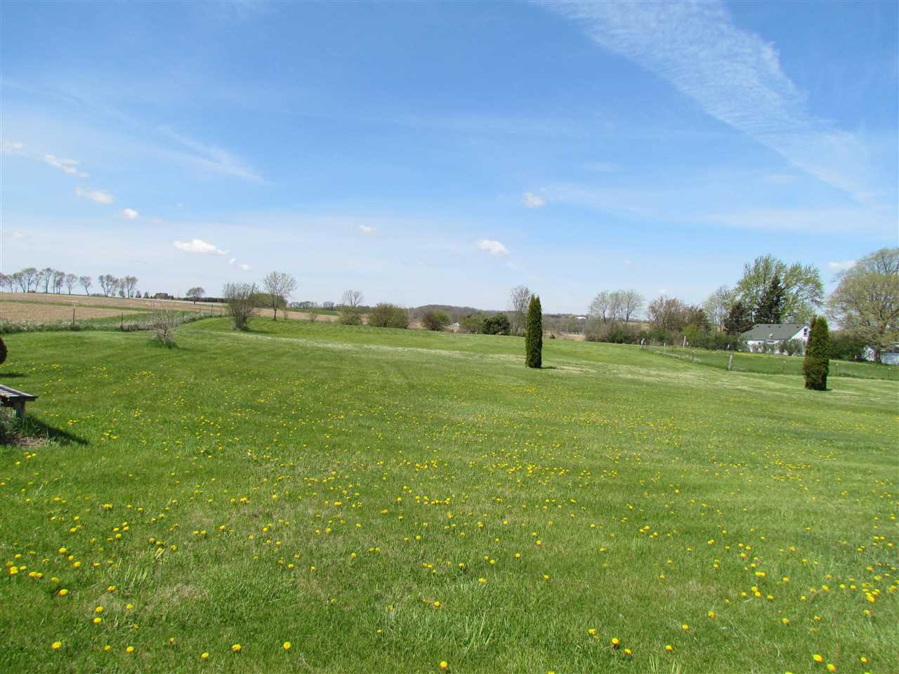 10494 Freeport Road Durand, IL 61024 - Photo 30 of 40 a view of a green field with clear sky