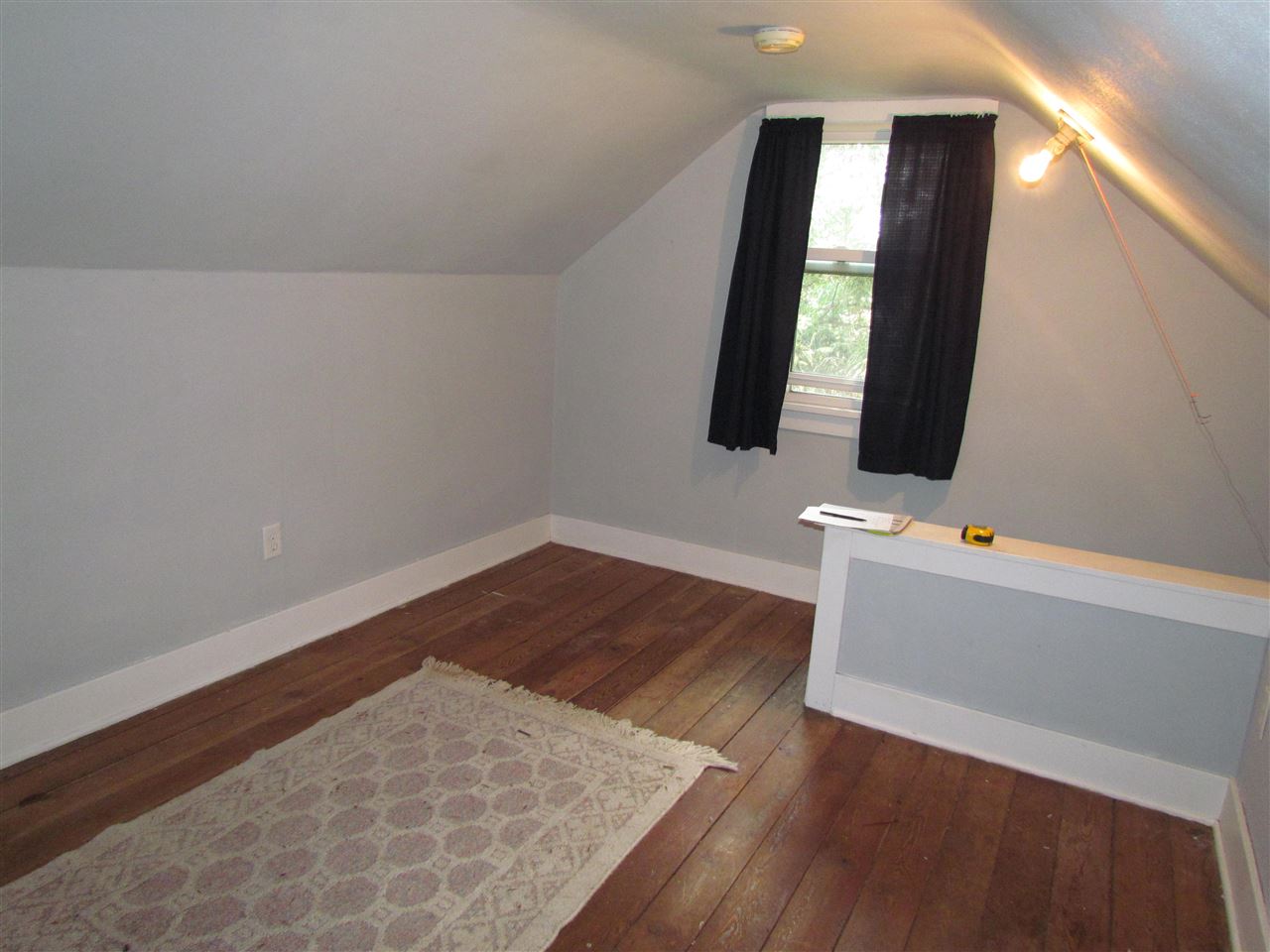 10494 Freeport Road Durand, IL 61024 - Photo 40 of 40 a view of a room with wooden floor and white walls