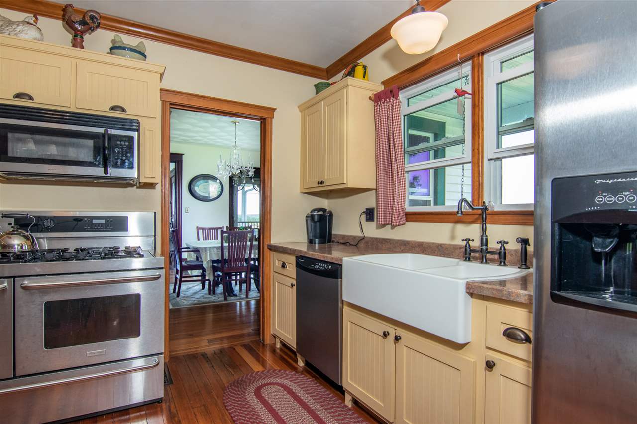 10494 Freeport Road Durand, IL 61024 - Photo 4 of 40 a kitchen with stainless steel appliances granite countertop a stove and a sink