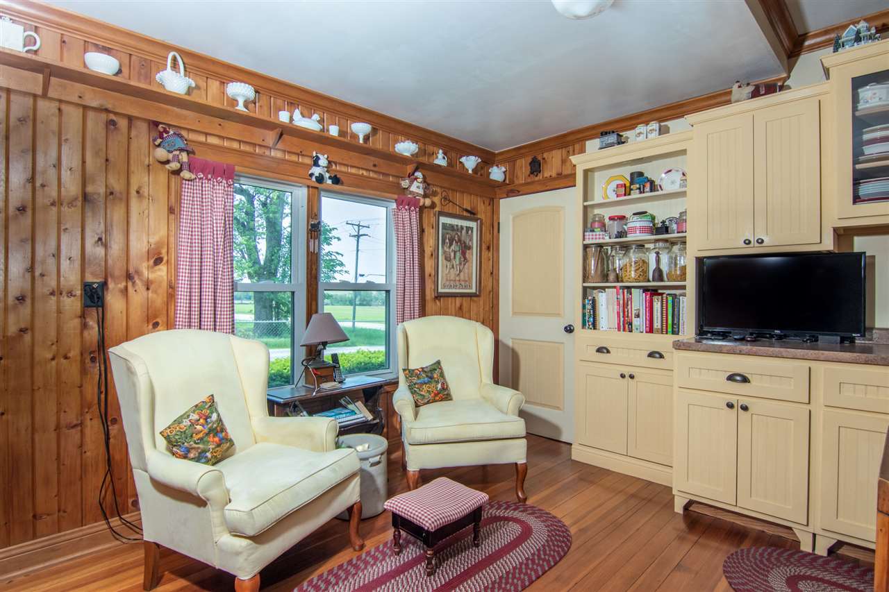 10494 Freeport Road Durand, IL 61024 - Photo 7 of 40 a living room with furniture and a flat screen tv