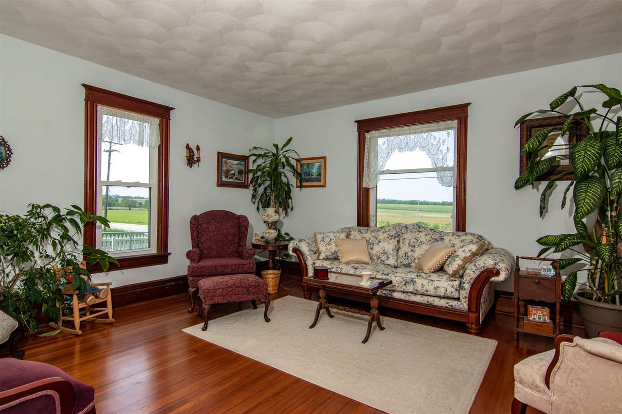 10494 Freeport Road Durand, IL 61024 - Photo 8 of 40 a living room with furniture and a potted plant