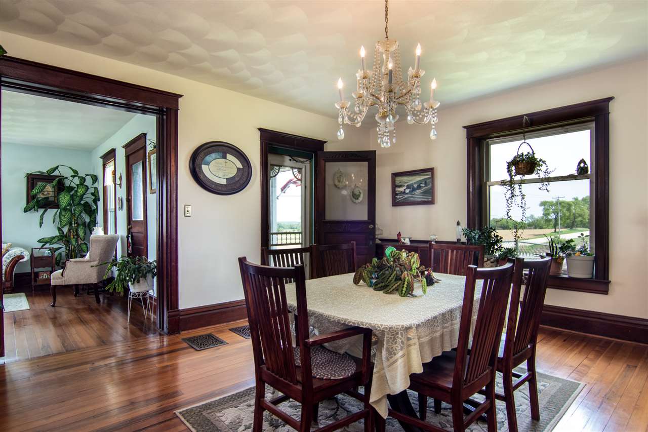 10494 Freeport Road Durand, IL 61024 - Photo 9 of 40 a view of a dining room with furniture window and wooden floor