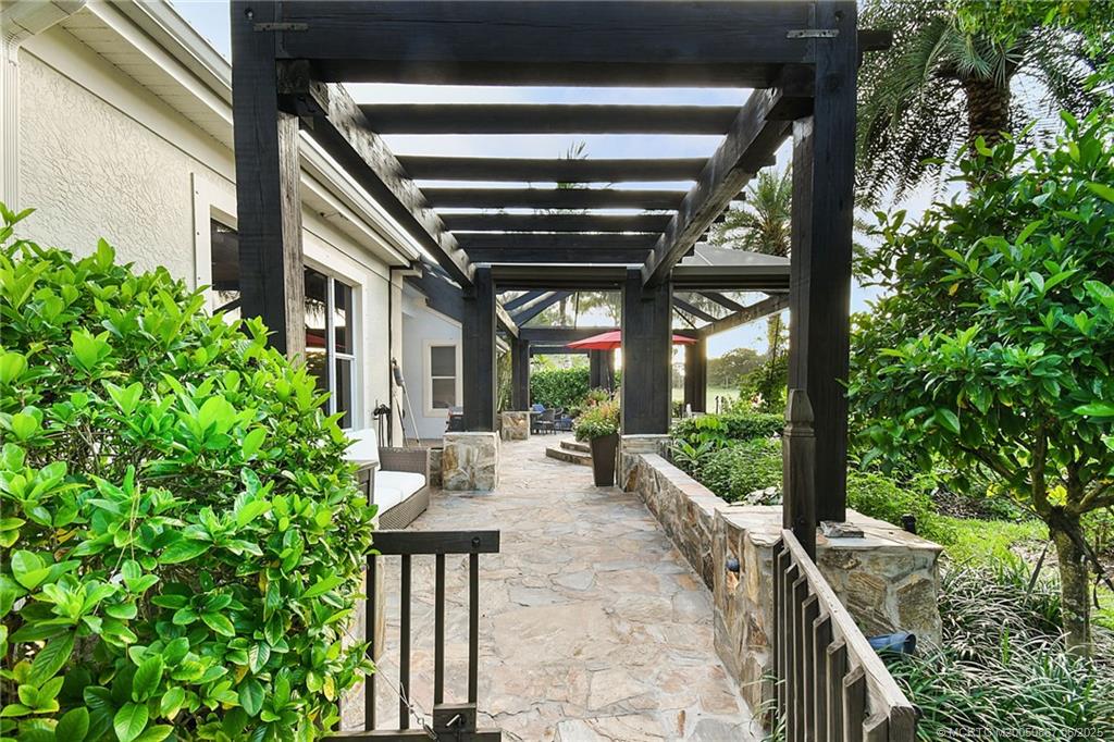 2109 Southeast Talbot Place Stuart, FL 34997 - Photo 38 of 59 Gated walkway to the side yard