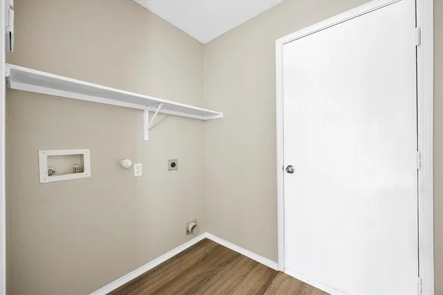 a view of a small space with wooden floor