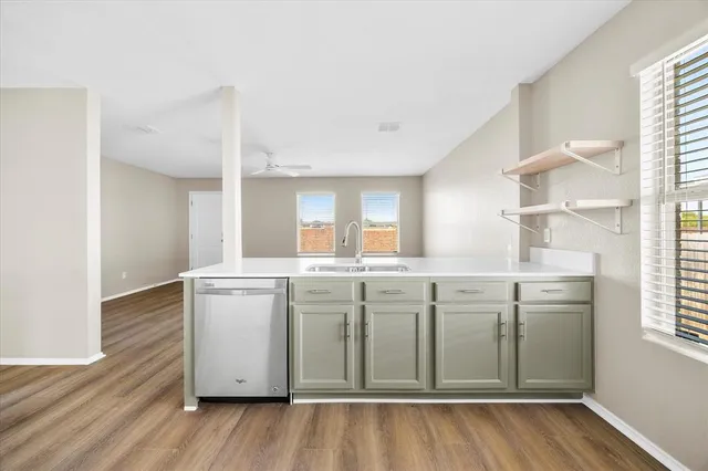 a room with cabinets and wooden floor