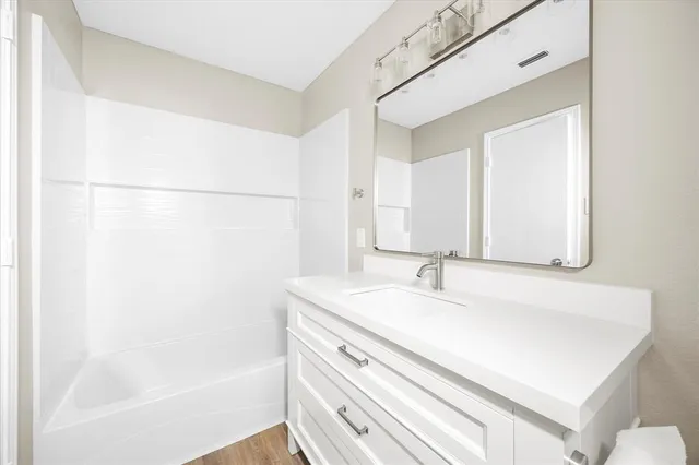 a bathroom with a sink and a bathtub
