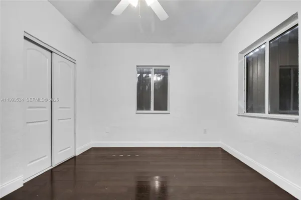 a bathroom with a sink toilet and mirror