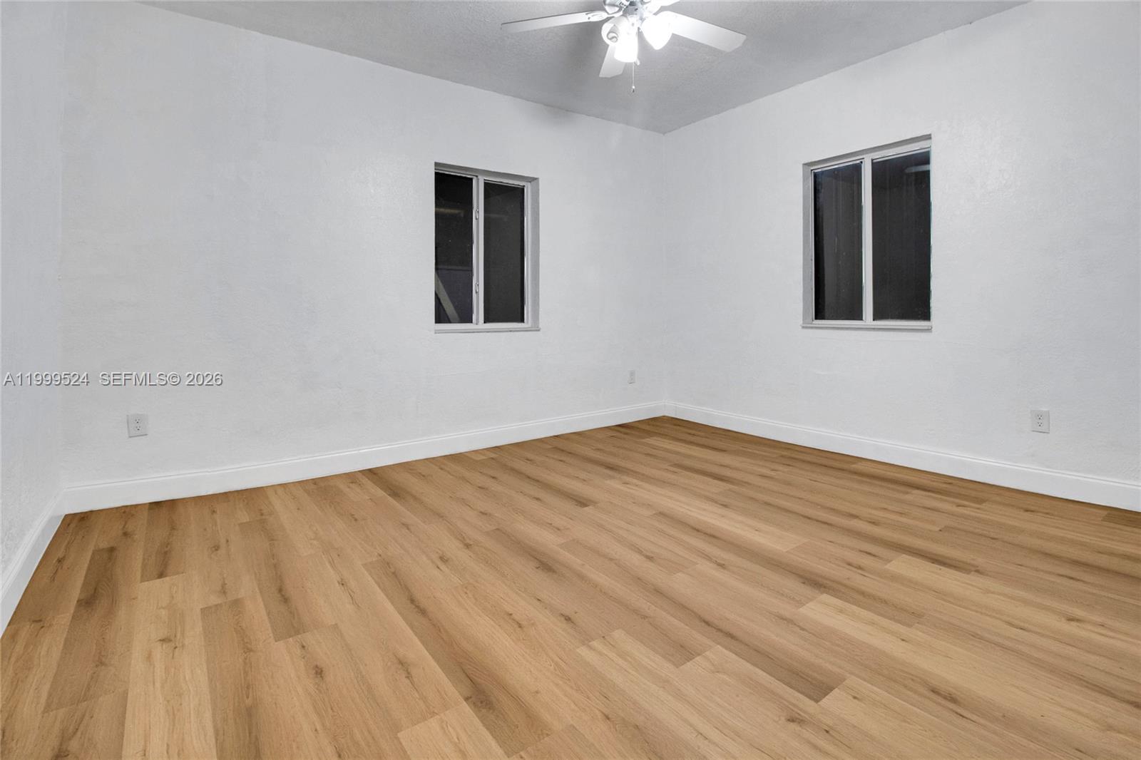 1925 Northwest 49th Street Miami, FL 33142 - Photo 24 of 30 a view of empty room with wooden floor
