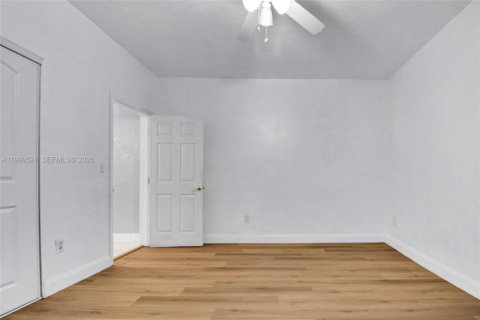 1925 Northwest 49th Street Miami, FL 33142 - Photo 26 of 30 a view of an empty room with wooden floor
