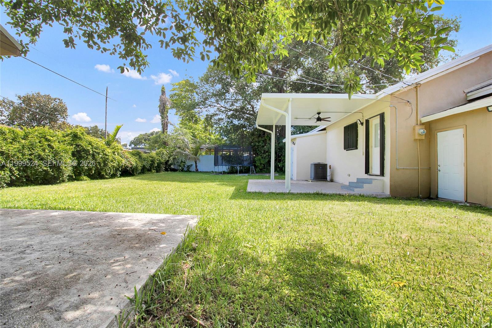 1925 Northwest 49th Street Miami, FL 33142 - Photo 28 of 30 a view of a house with backyard and garden