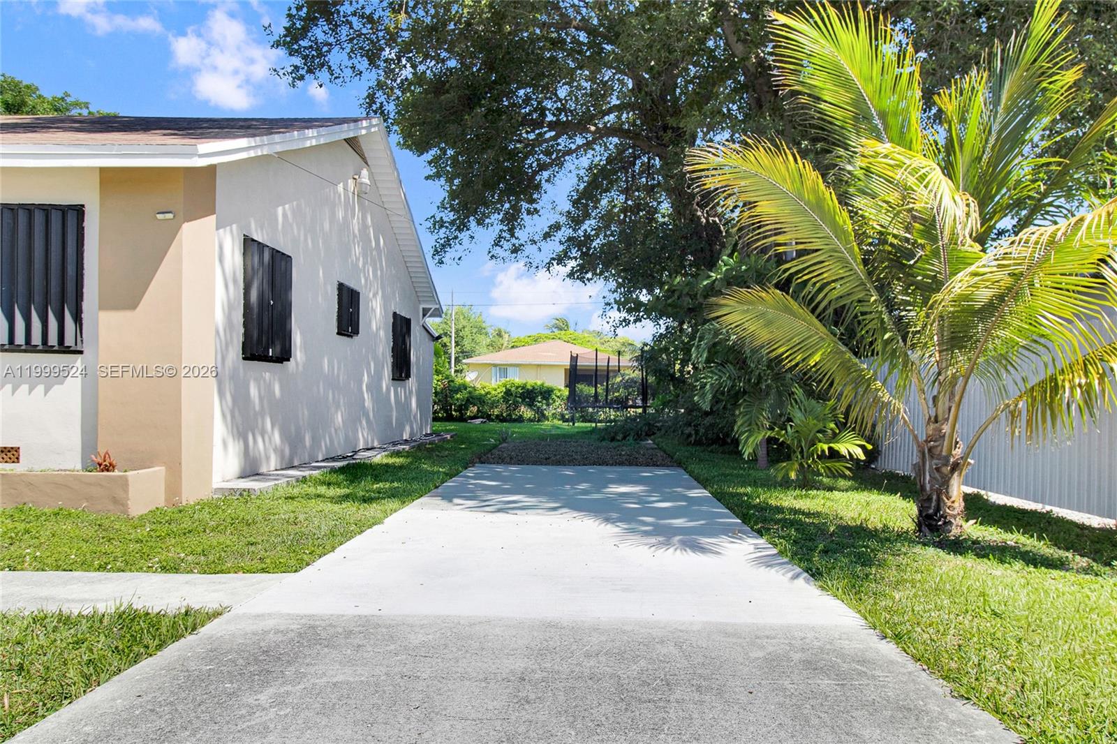 1925 Northwest 49th Street Miami, FL 33142 - Photo 3 of 30 a front view of house with yard
