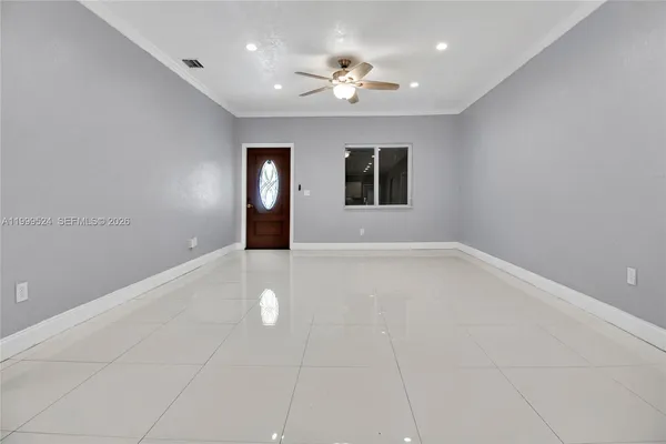 a view of an empty room with a window