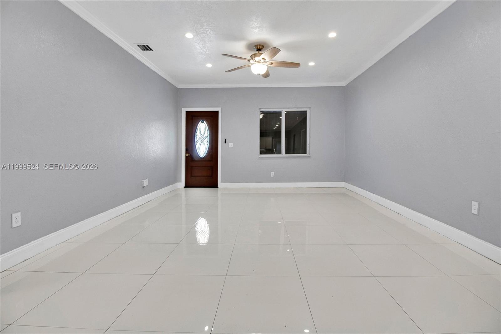 1925 Northwest 49th Street Miami, FL 33142 - Photo 7 of 30 a view of an empty room with a window