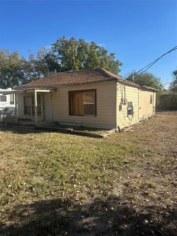 a house with trees in the background