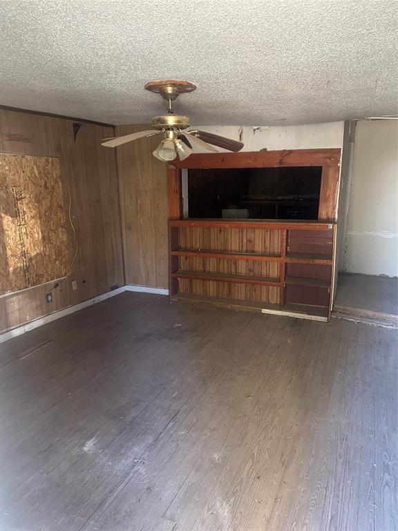 1015 South Pecos Street Coleman, TX 76834 - Photo 3 of 7 a living room with furniture and a ceiling fan