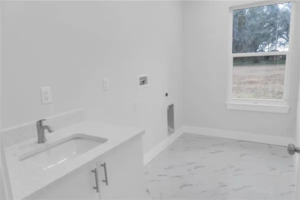 a bathroom with a sink and a bathtub