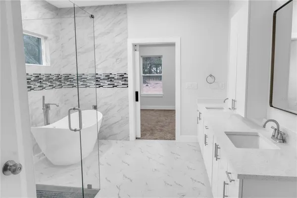 a bathroom with a sink and a shower