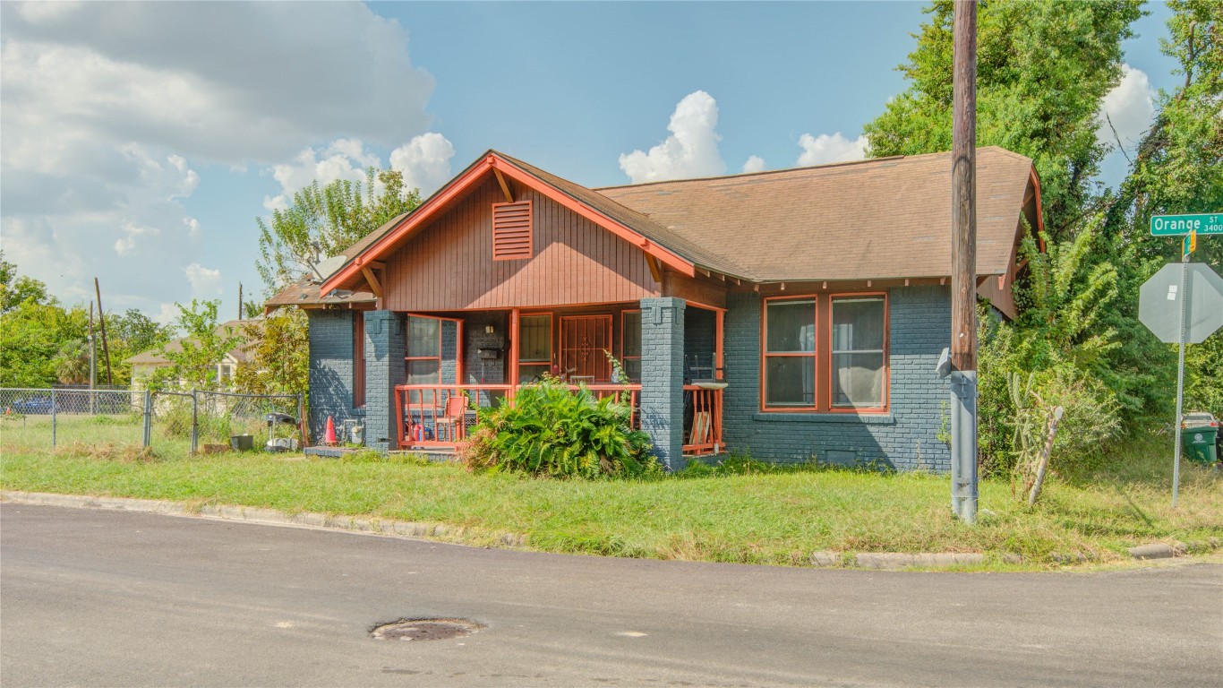 3405 Orange Street Houston, TX 77020 - Photo 2 of 19 a front view of a house with a yard and potted plants