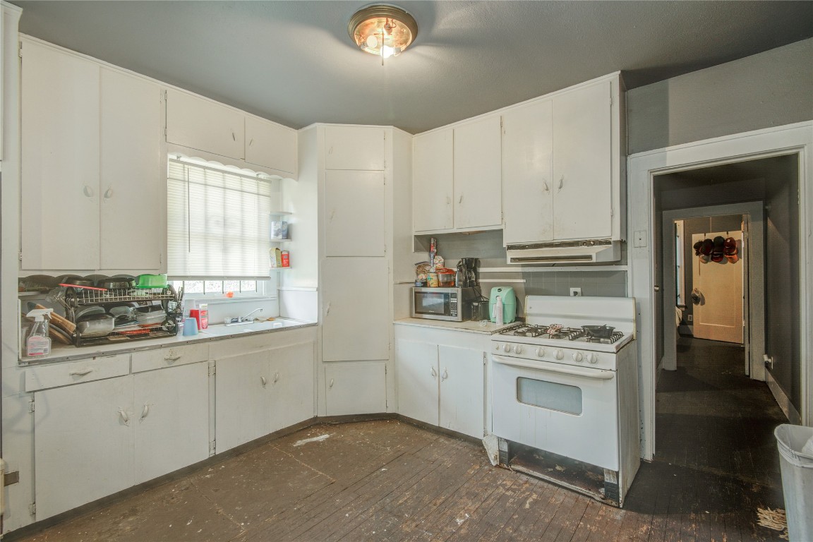 3405 Orange Street Houston, TX 77020 - Photo 6 of 19 a kitchen with a stove top oven sink and cabinets