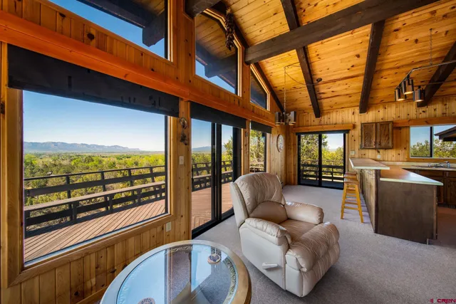 a view of a house with a mountain in the background