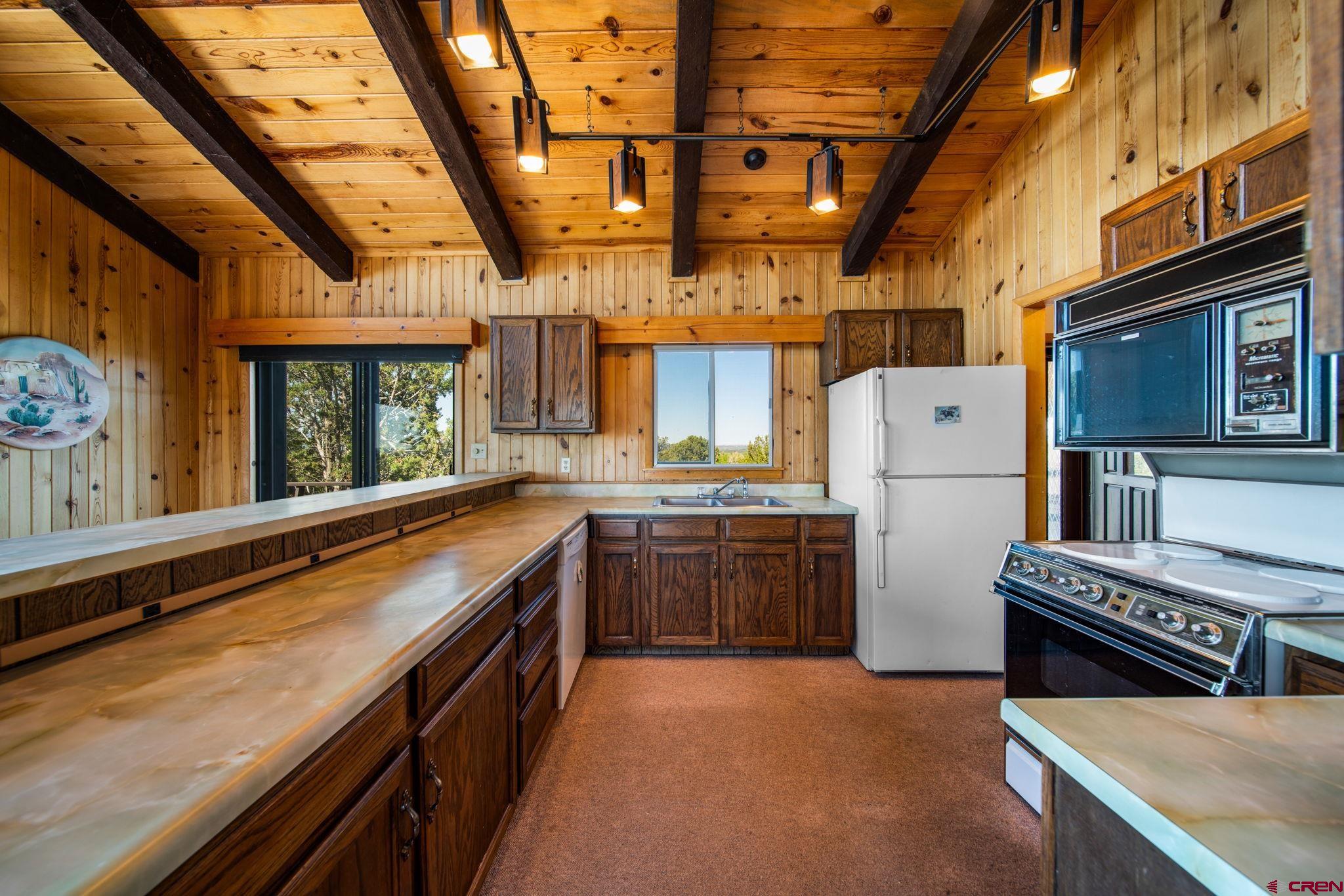 27255 Rd P Dolores, CO 81323 - Photo 10 of 45 a kitchen with cabinets and a stove