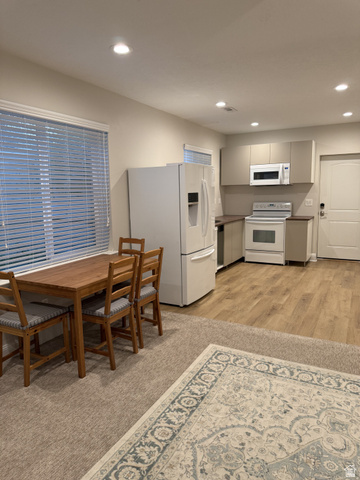 2388 East 850 South Springville, UT 84663 - Photo 41 of 58 Kitchen area featuring wood-finish flooring, white appliances, and recessed lighting