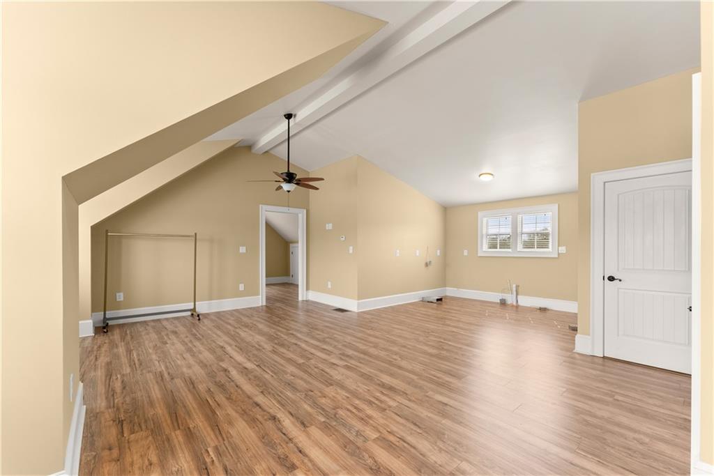 725 County Farm Road Jefferson, GA 30549 - Photo 39 of 66 a view of an empty room with window and wooden floor