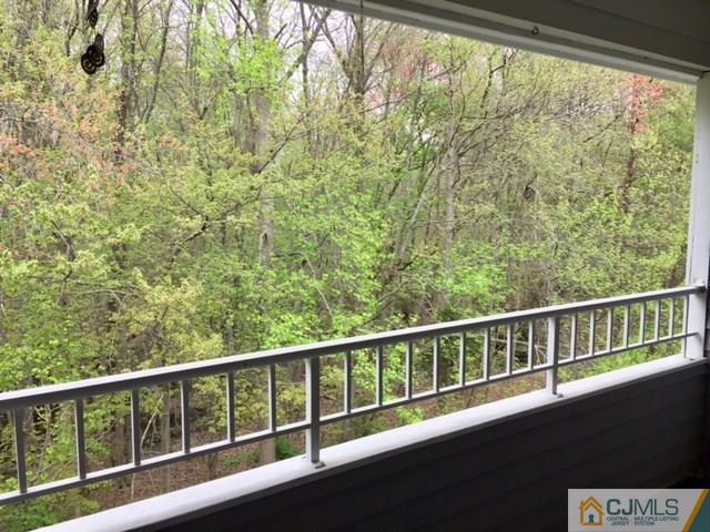 111 Raintree Court, Unit 111 Helmetta, NJ 08828 - Photo 4 of 11 a view of a balcony