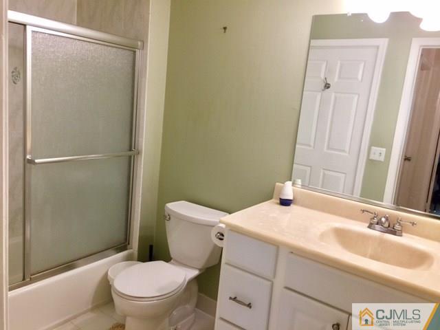 111 Raintree Court, Unit 111 Helmetta, NJ 08828 - Photo 5 of 11 a bathroom with a sink toilet and shower
