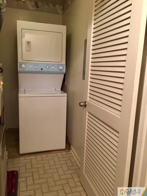 111 Raintree Court, Unit 111 Helmetta, NJ 08828 - Photo 8 of 11 a utility room with dryer and washer