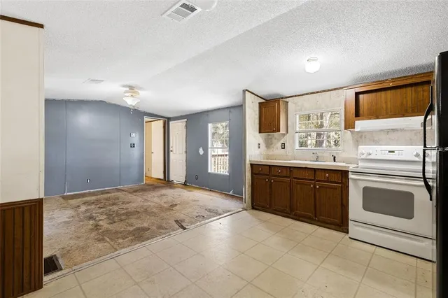 a spacious bathroom with a sink a vanity and a mirror