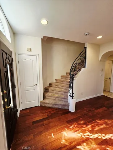 a view of entryway with wooden floor