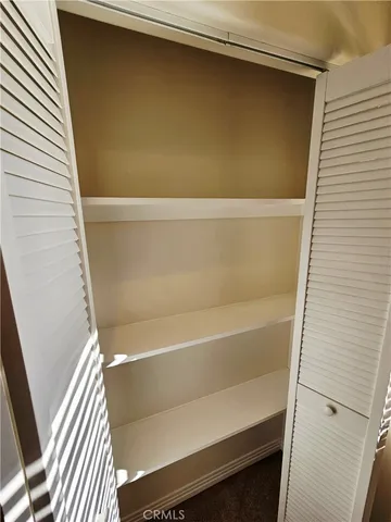 a view of a hallway with stairs