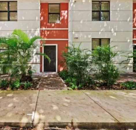 a view of a building with potted plants