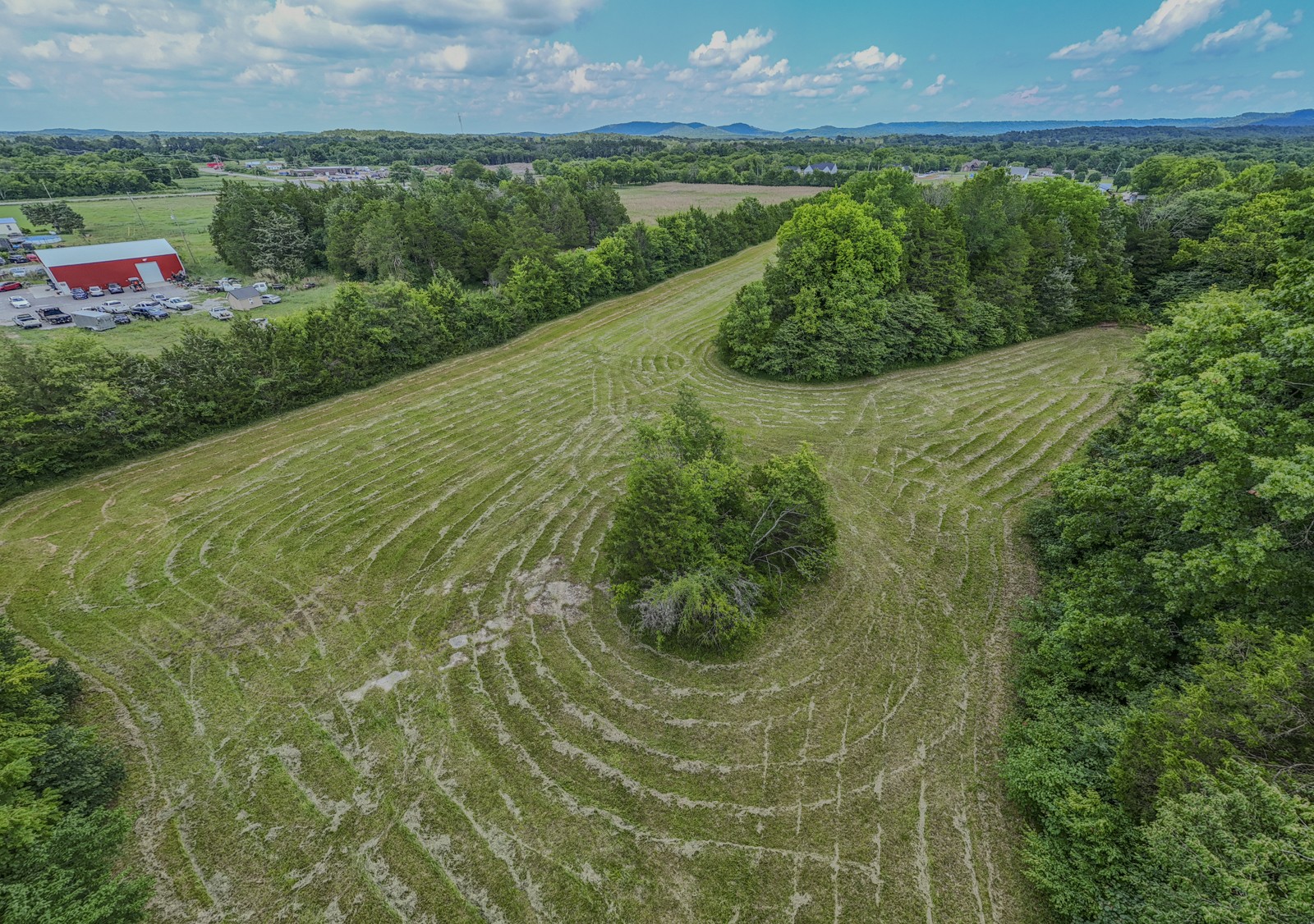 7068 Miller Road Christiana, TN 37037 - Photo 6 of 21 a view of a lush green outdoor space with a swimming pool and valleys in the background