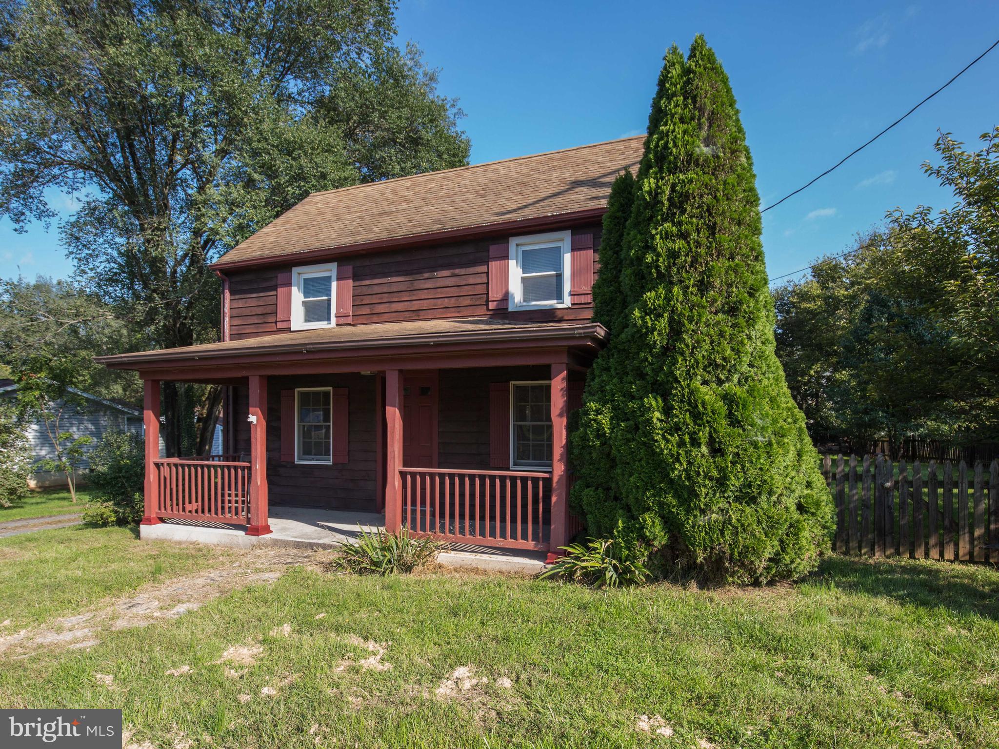 193 Giles Mill Road Bunker Hill, WV 25413 - Photo 2 of 29 a view of a house with a yard and plants