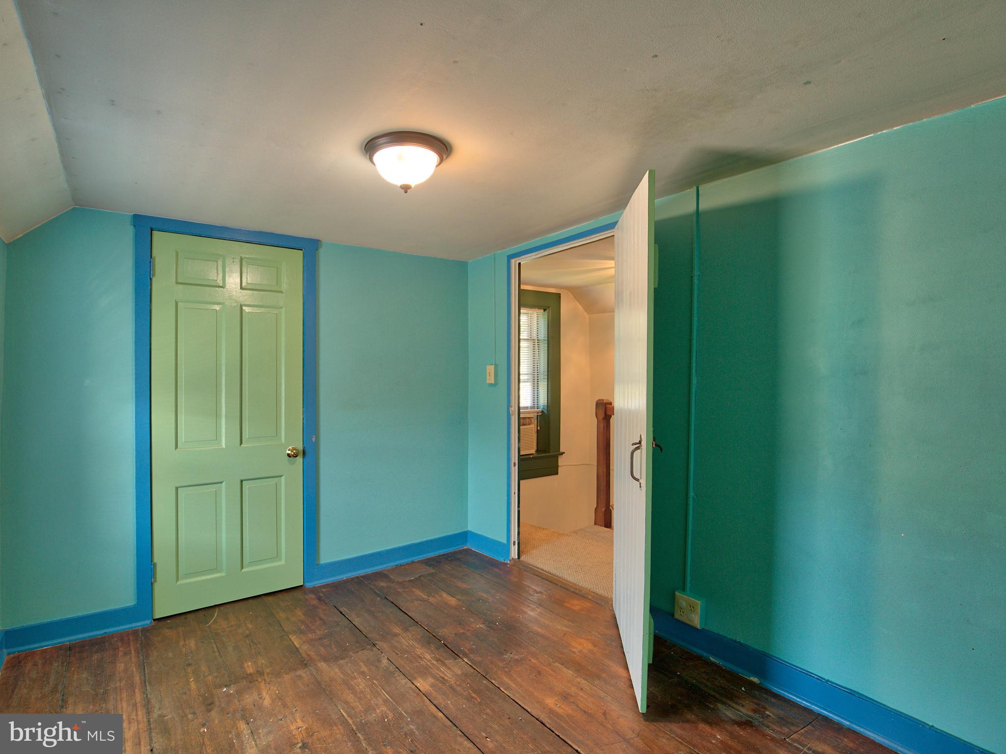 193 Giles Mill Road Bunker Hill, WV 25413 - Photo 28 of 29 an empty room with closet and a bathroom