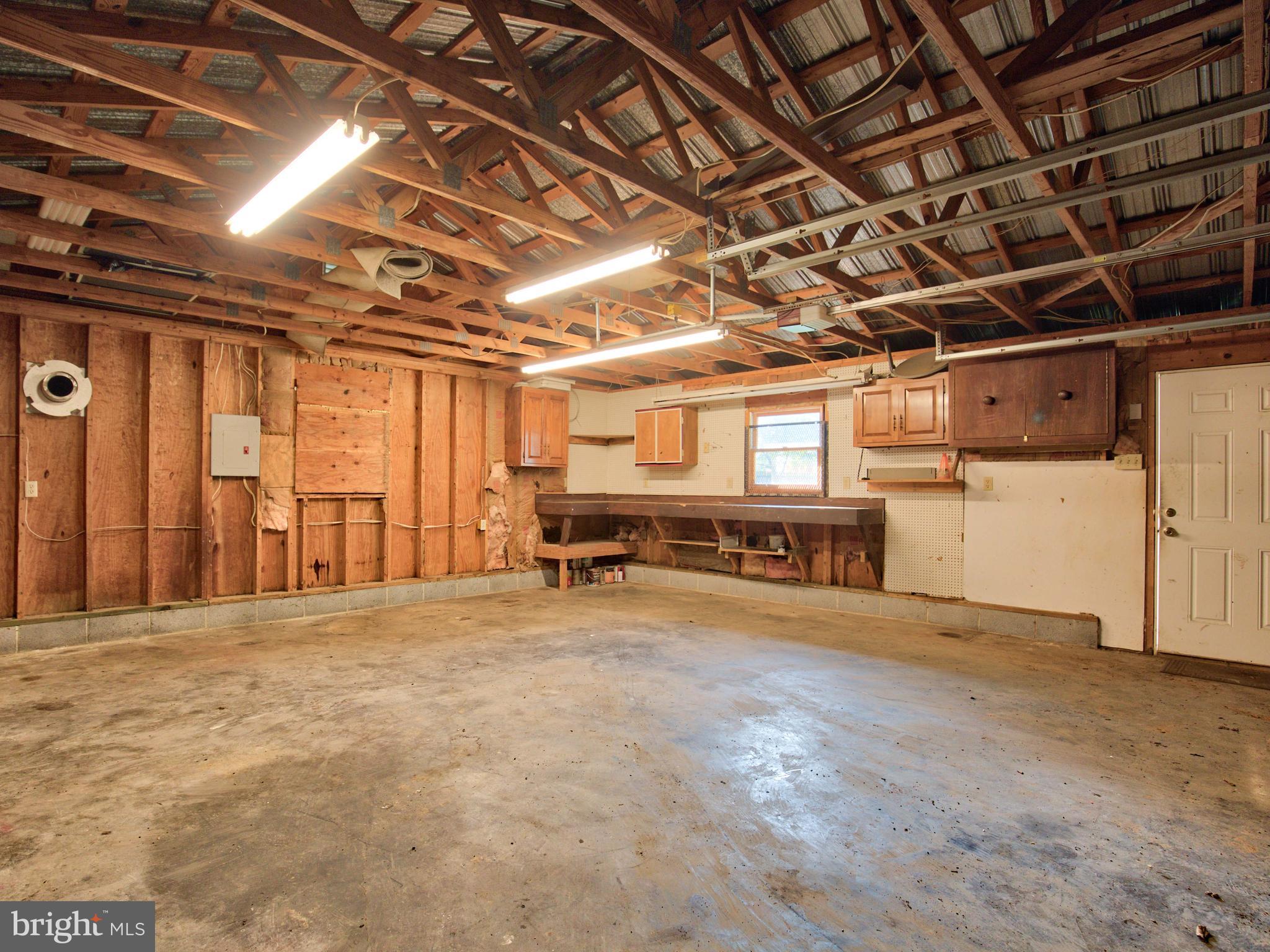 193 Giles Mill Road Bunker Hill, WV 25413 - Photo 9 of 29 a view of a room with wooden walls