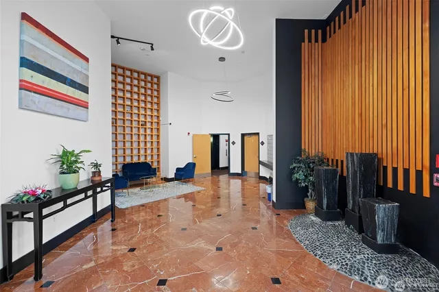 a view of a tall building next to a road