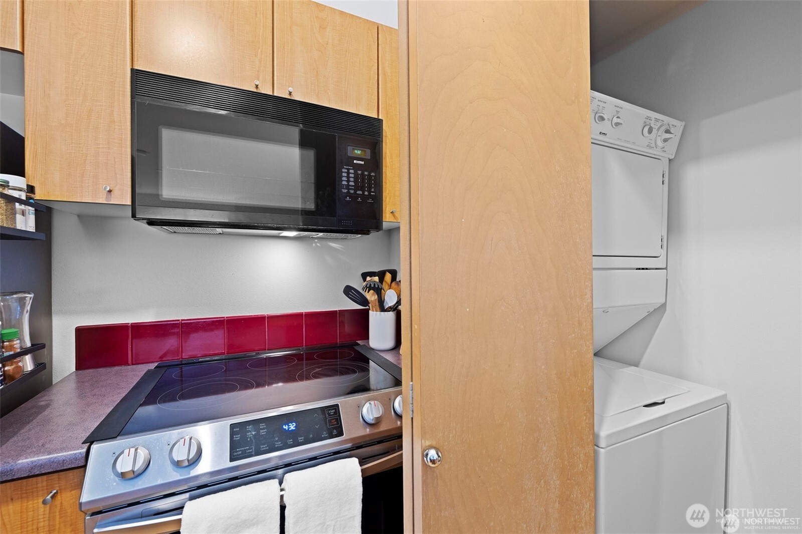 668 South Lane Street, Unit 603 Seattle, WA 98104 - Photo 6 of 22 a living room with stainless steel appliances and cabinets