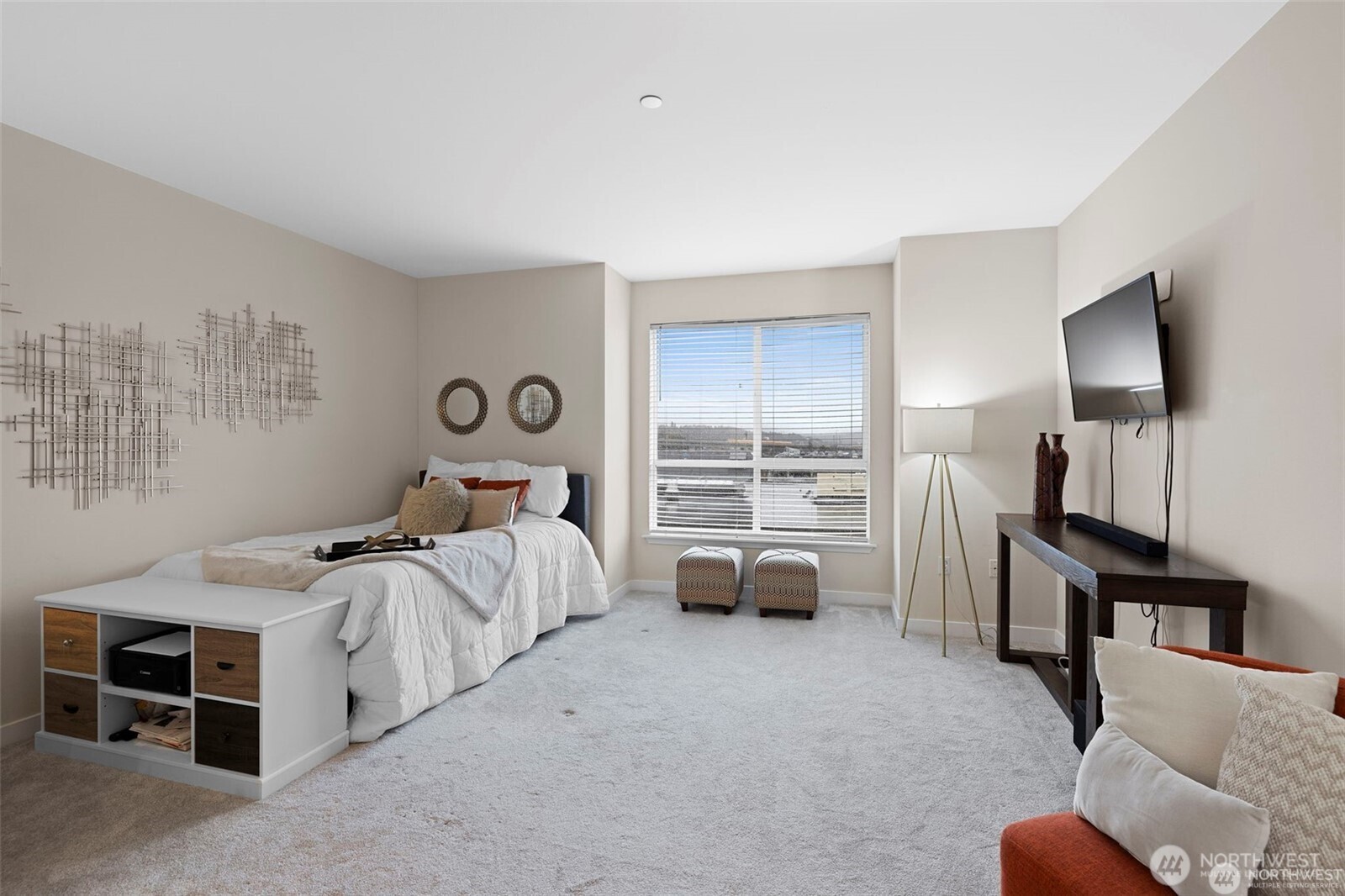 668 South Lane Street, Unit 603 Seattle, WA 98104 - Photo 9 of 22 a bed room with a bed and a television