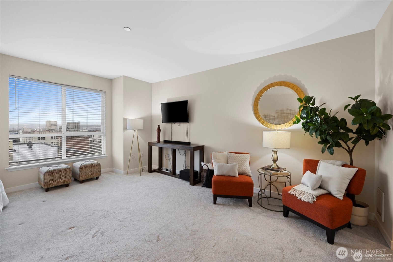 668 South Lane Street, Unit 603 Seattle, WA 98104 - Photo 10 of 22 a living room with furniture and a flat screen tv