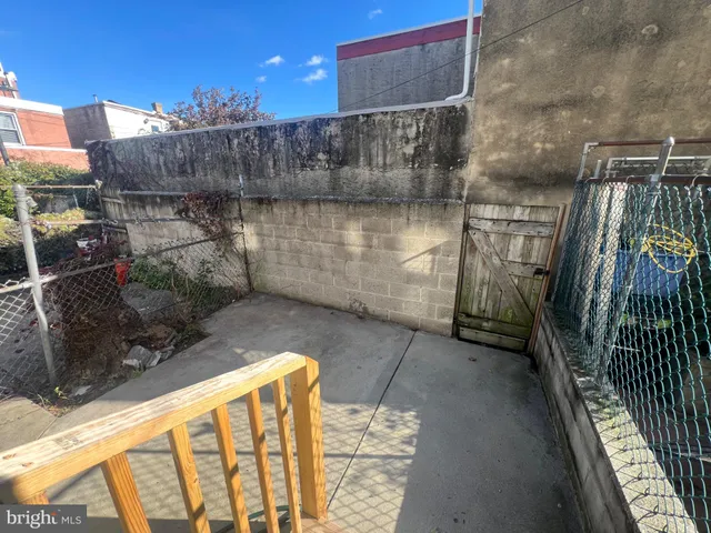 a view of a house with a wooden deck