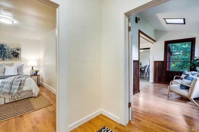 a bedroom with furniture and a wooden floor