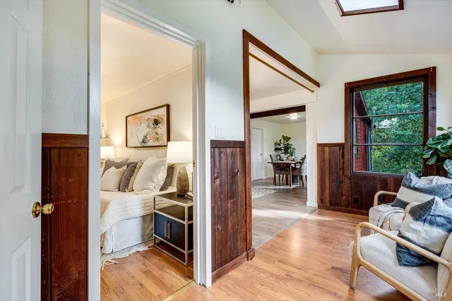 a bedroom with furniture and a window